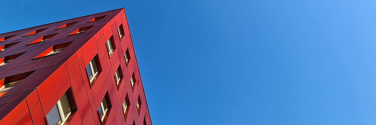 Buy-lo-let apartment building with red facade
