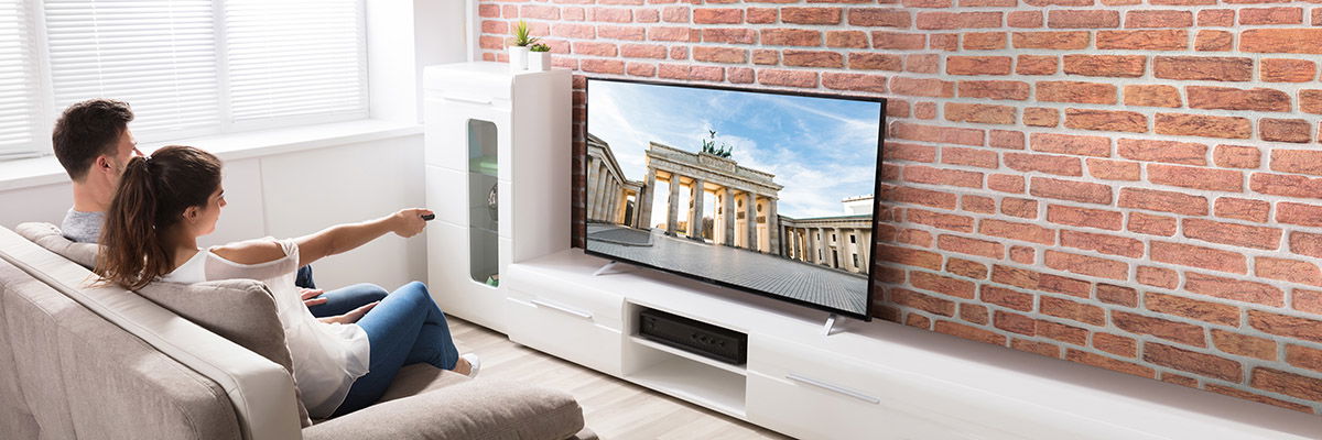 Couple watching television in a buy-to-let home